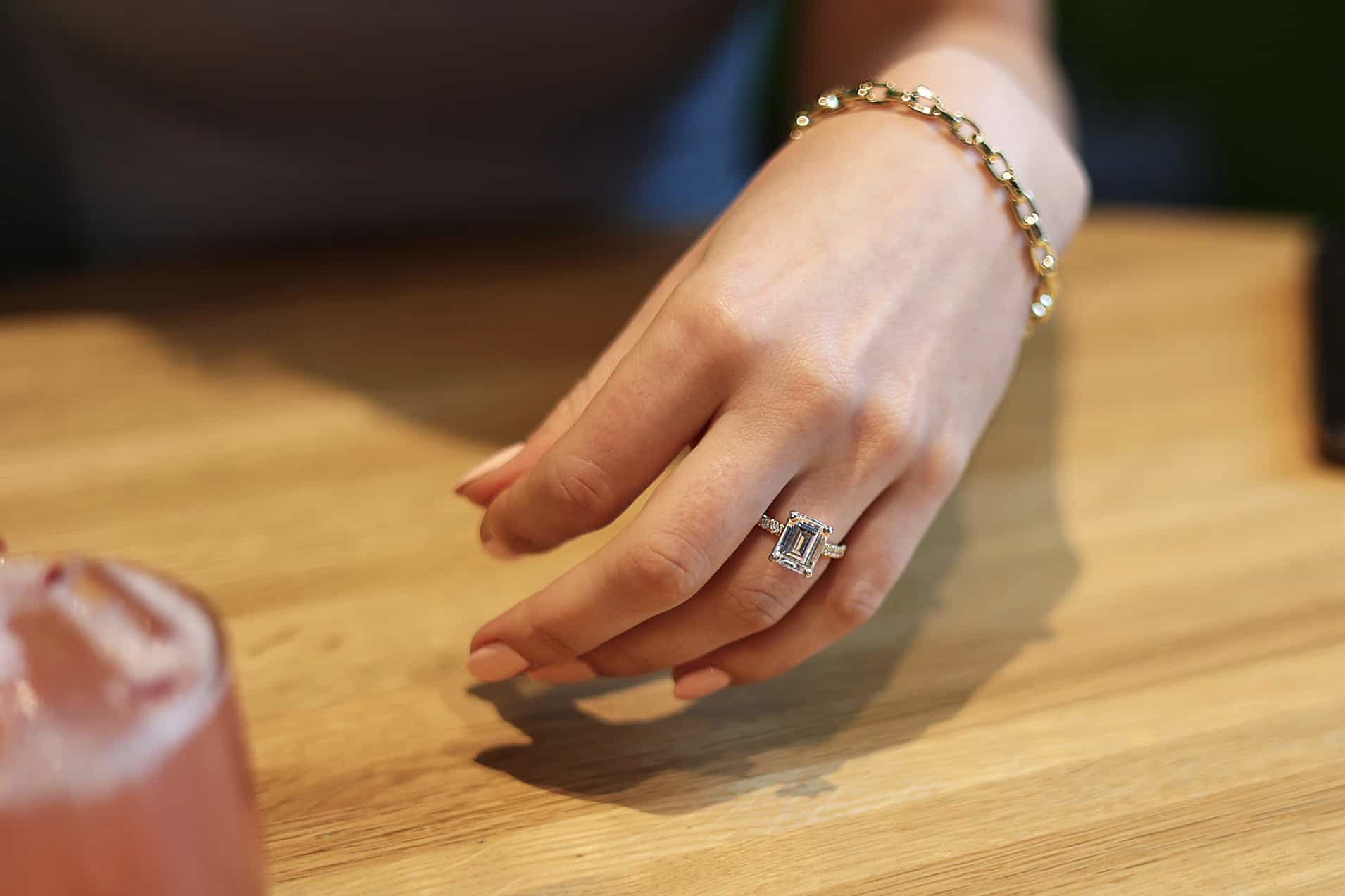 Emerald cut pave engagement ring