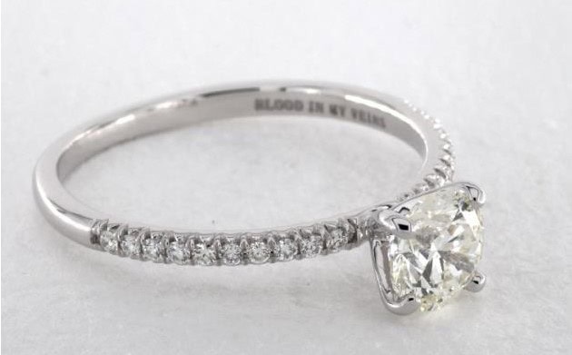 platinum pave settign with a K color diamond 