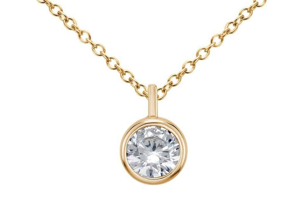A bezel pendant in 14K Yellow Gold for a round cut diamond